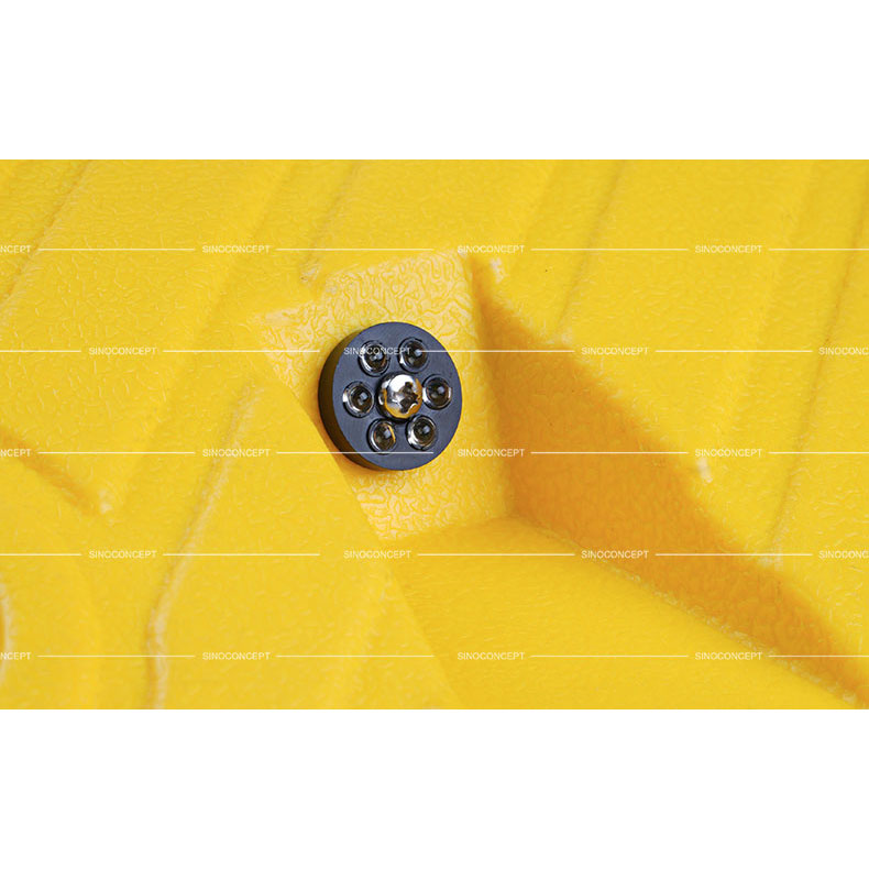 A glass bead reflector embedded on the speed bump to increase visibility.