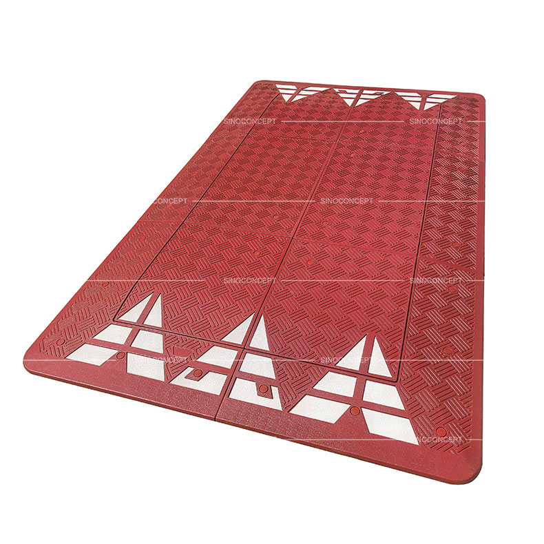 A red 6-part Europe style speed cushion made of Plastic-Rubber composite for traffic-calming purposes.
