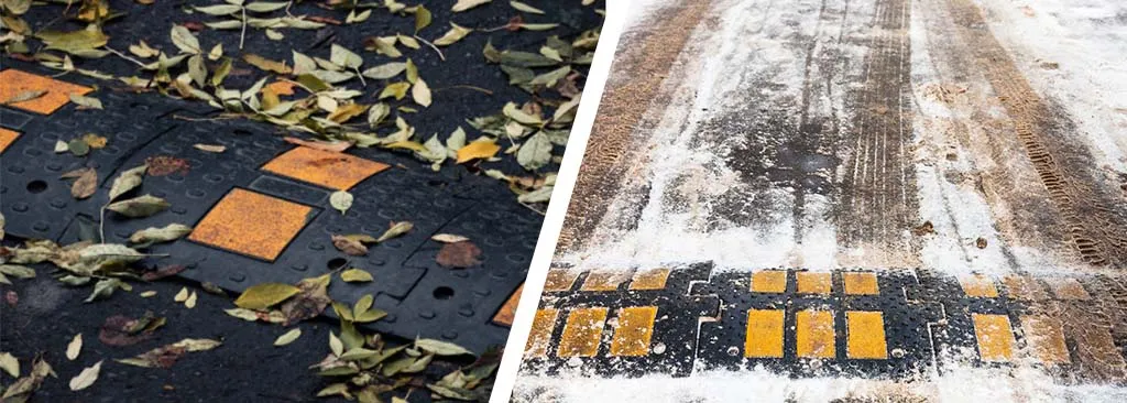 Black and yellow speed hump in the wet weather and in the snow.
