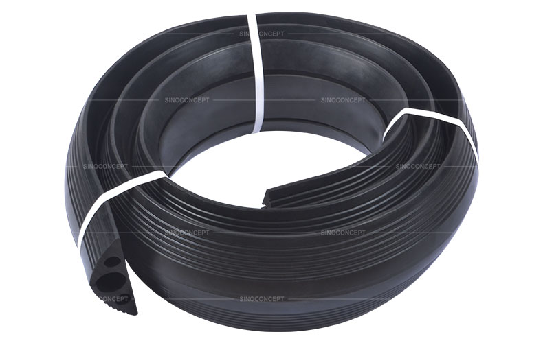 3 channels floor cable cover also called cable protector made of black rubber designed to receive three cables for floor cable management