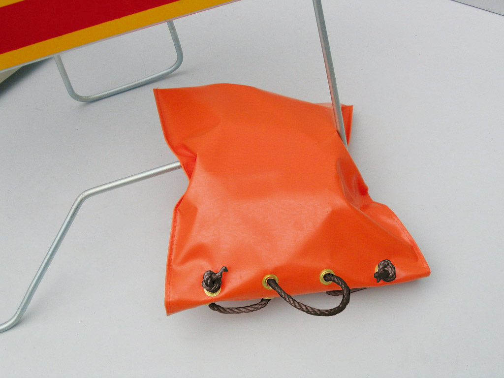 1-PVC-sandbag PVC sandbag coloured in orange and designed with black strings to keep it tight to use