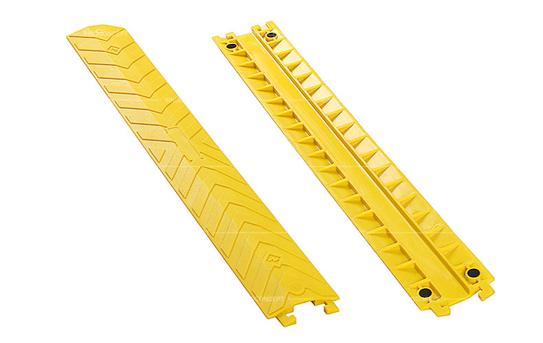 Small size yellow drop over cable protectors made of polyurethane designed with skidproof surface and four black anti-slip pads