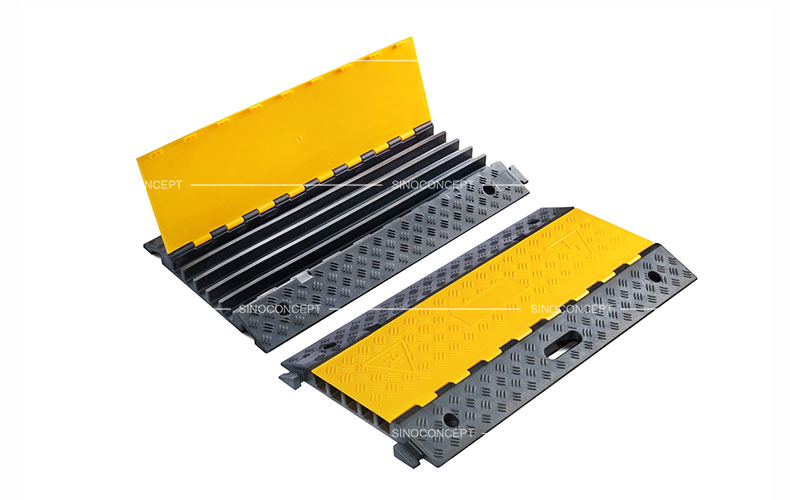 5 channels cable ramps made of rubber also called cable protectors designed with anti-slip surface and yellow plastic lids.
