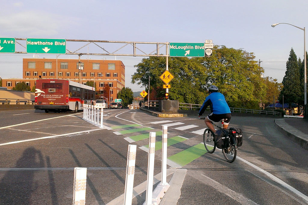 Lane separators with posts inserted on the bases to divide cycle lanes and motor lanes