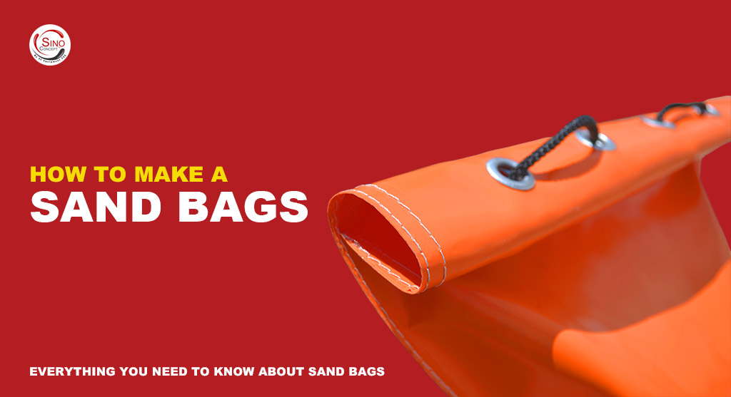 A PVC sandbag coloured in orange with black strings for traffic management use