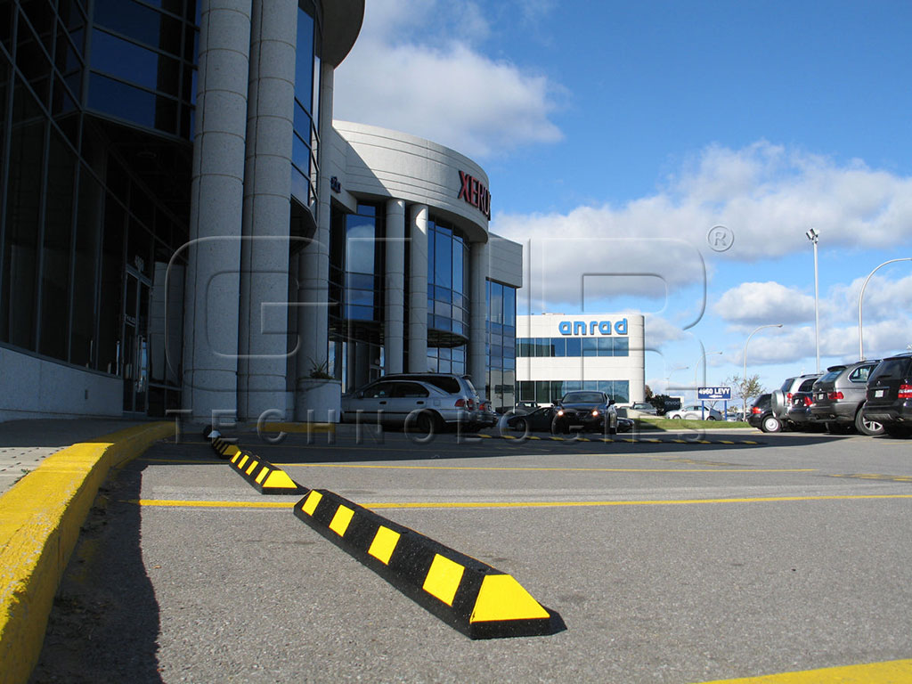 Park-It wheel stops coloured in yellow and pasted with yellow reflective tapes