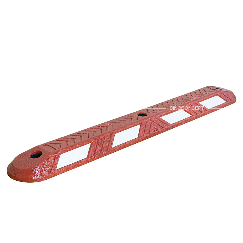 A red lane divider with white reflective films used for traffic management.