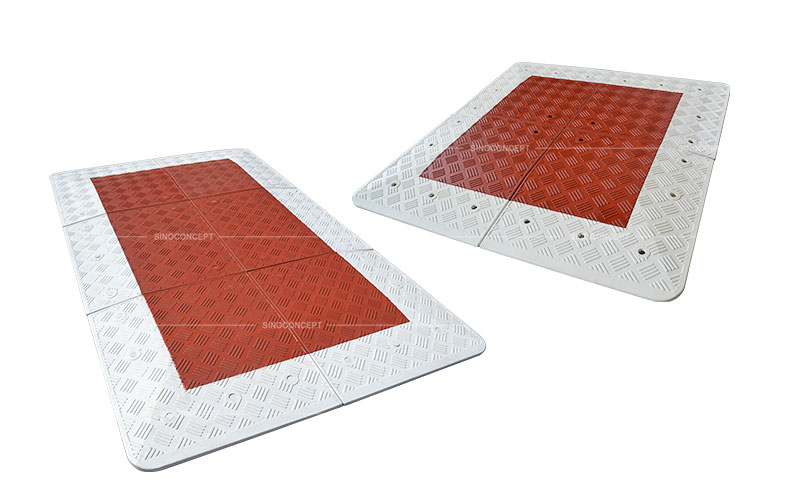Red traffic calming speed cushions with white edges also called rubber speed tables used for traffic calming purpose