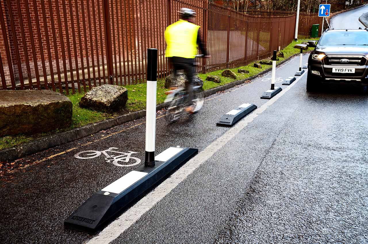 Black and white Rosehill cycle lane defenders with black and white posts inserted in the middle