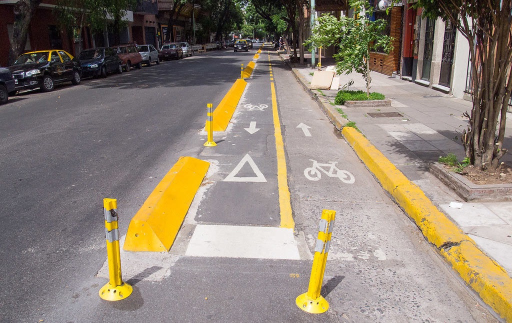 Yellow lane dividers made of concrete and yellow posts to separate cycle lanes for cycle riders