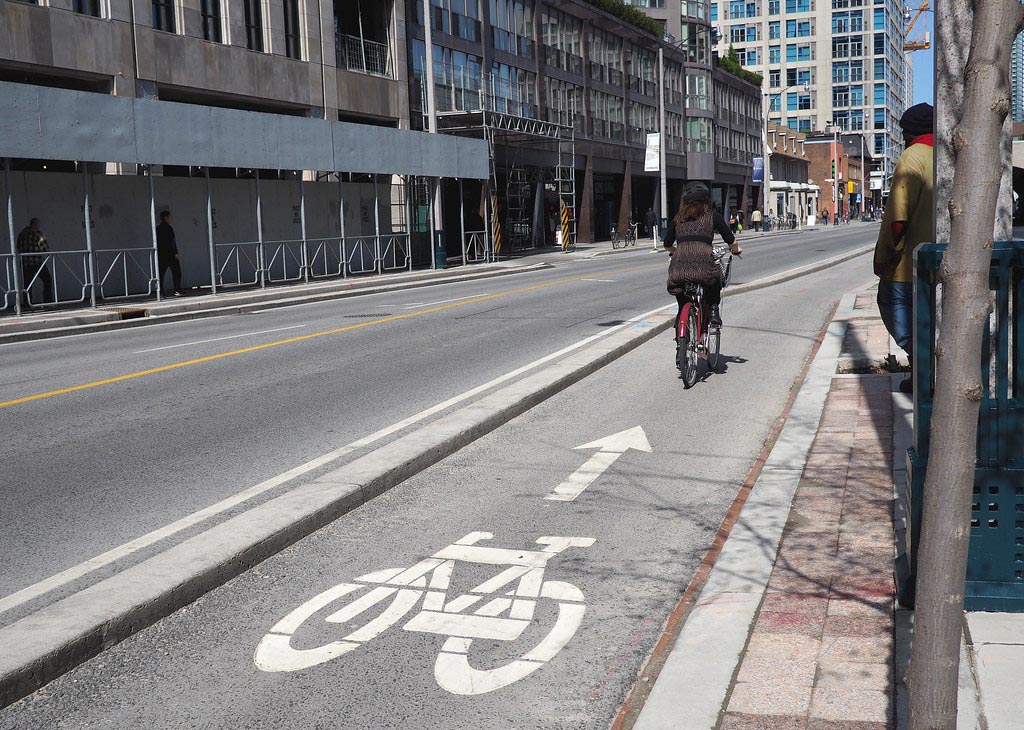 Bicycle lanes with white road markings for cyclists' safe and better traffic situation