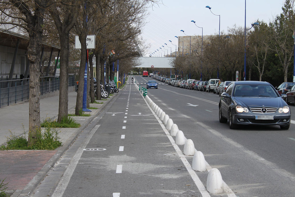 Concrete lane dividers fixed on the road to separate cycle lanes with motor vehicle lines