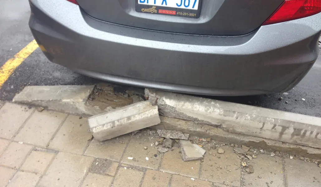 Damaged concrete parking block