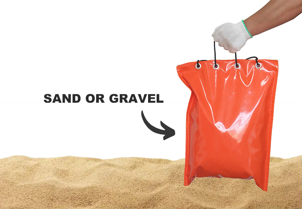 An orange sandbag filled with sand or gravel for holding down traffic signposts