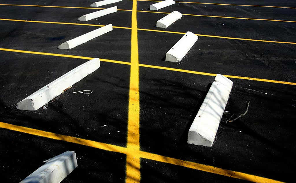 White parking blocks made of concrete used in outside parking space