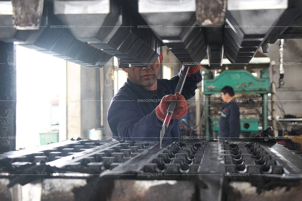 A worker is manufacturing parking kerbs in the Sino Concept factory