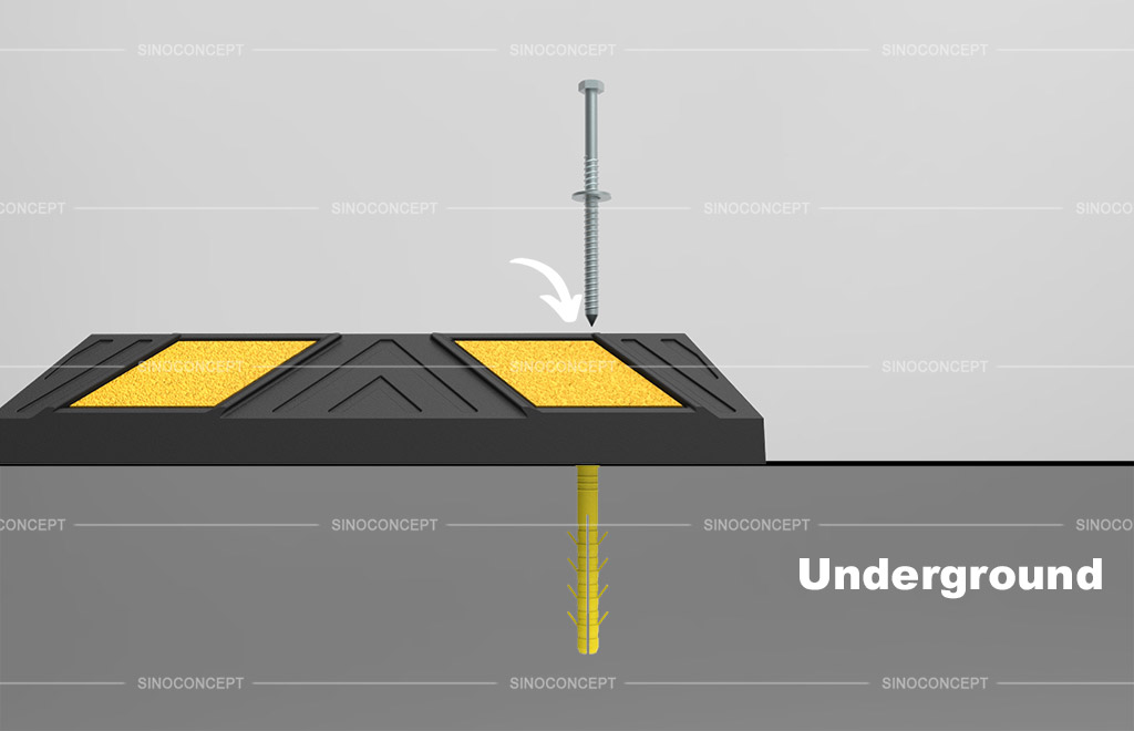 Parking stop installation with screws stuck into the underground