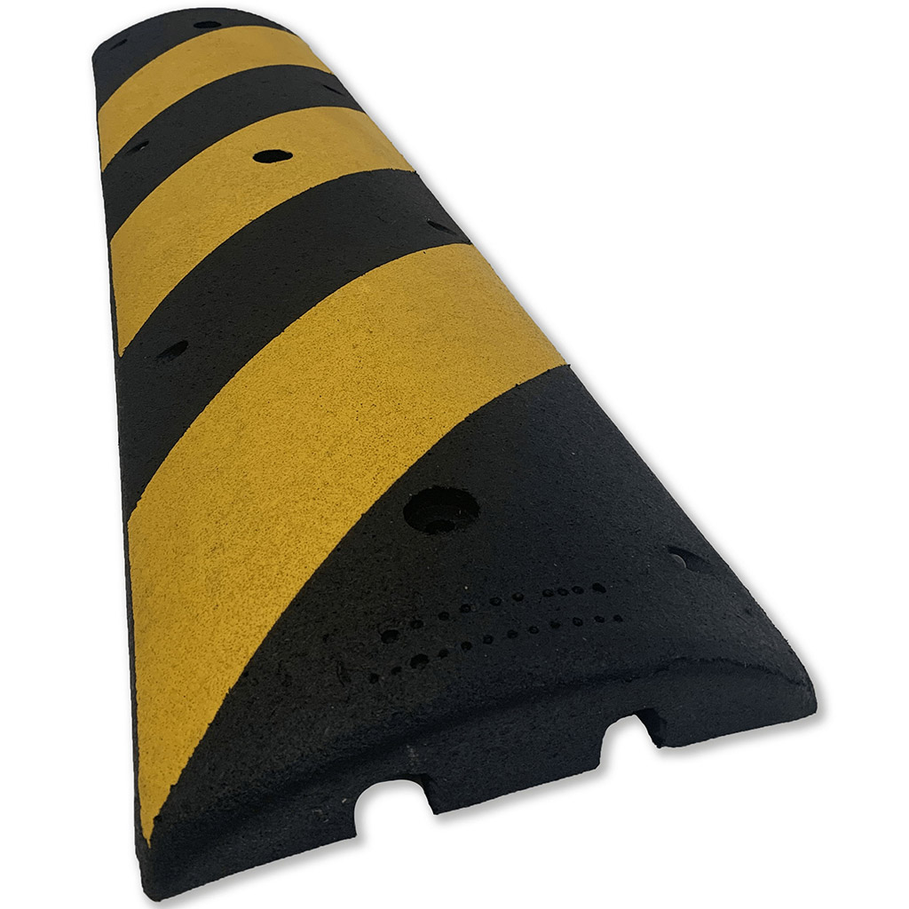 Black and yellow road bump made by Easy Rider for traffic management