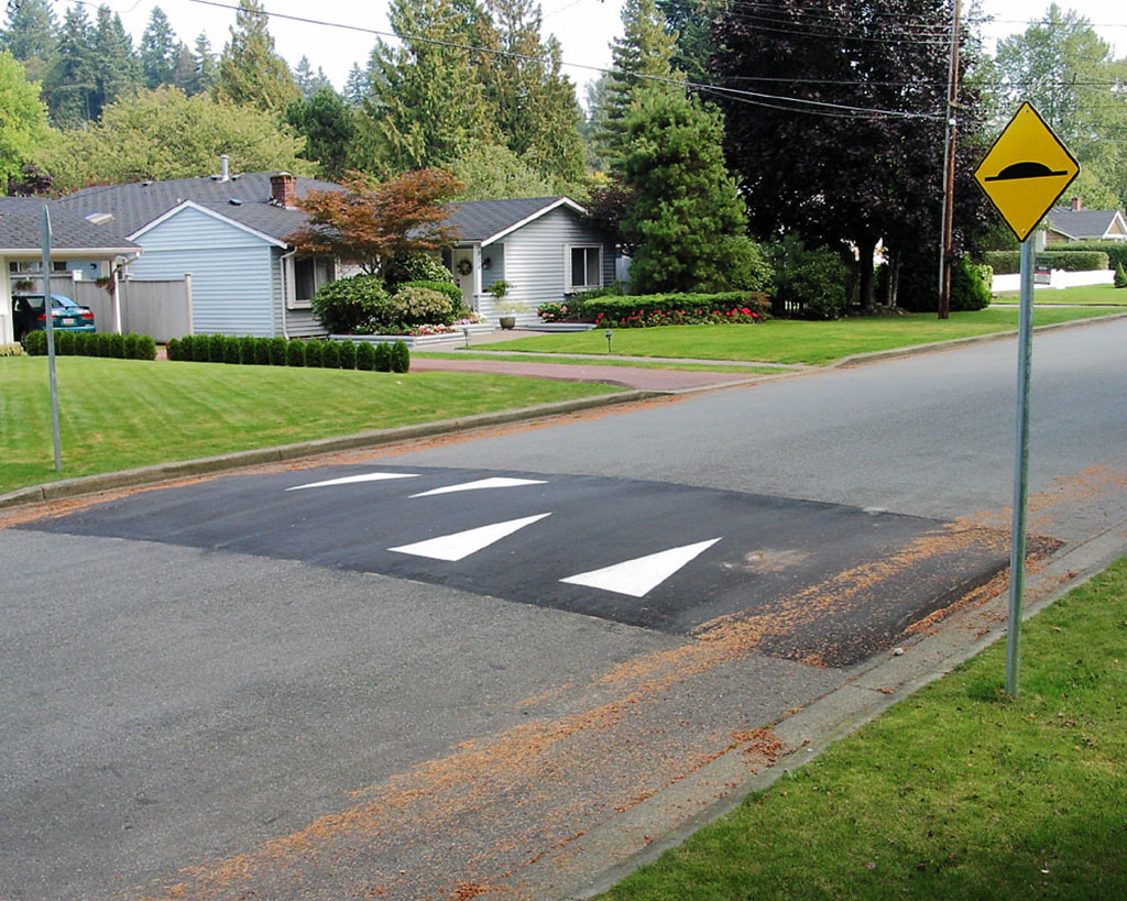 Asphalt speed hump set across the road for improving traffic safety