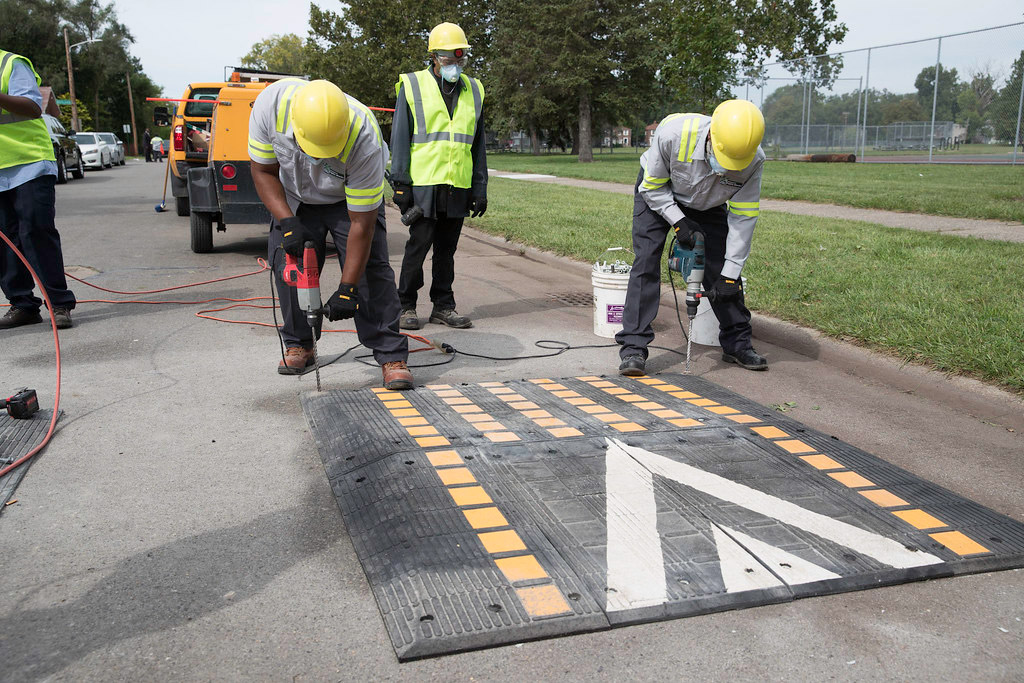 Workers are installing speed hump.