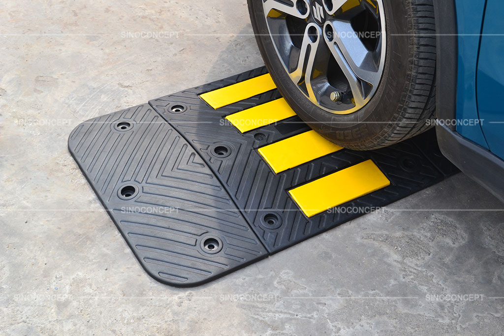 Speed hump made of recycled rubber pasted with yellow reflective films for better traffic management