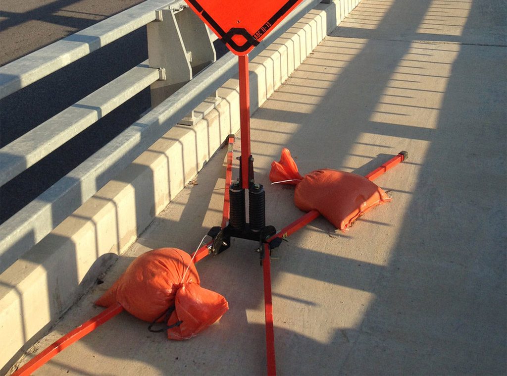 Traffic sandbags used to hold down traffic signs on the roadside