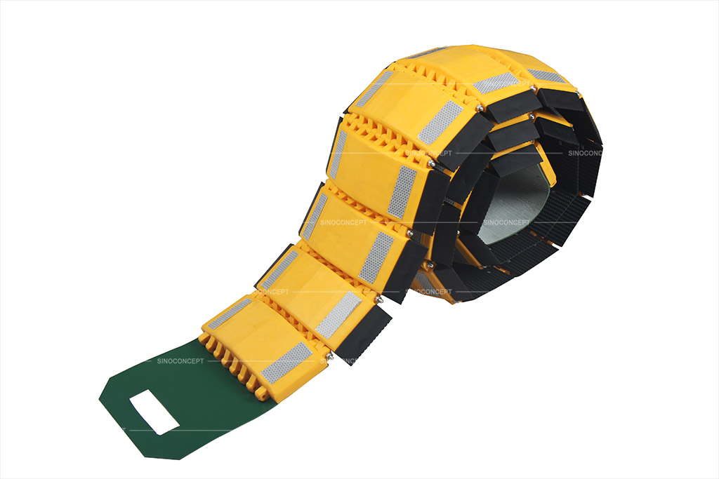 Portable speed bump with yellow surface and grey reflective films.