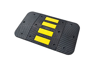Traffic speed hump of 600 mm type made of black vulcanized rubber with yellow reflective tapes as a traffic calming device