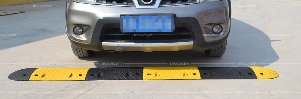 Road speed bump also called traffic road bump made of black and yellow recycled rubber as a traffic calming device