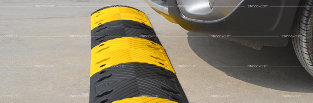 Rubber speed bump also called road bump coloured in black and yellow used on parking lots for car park management