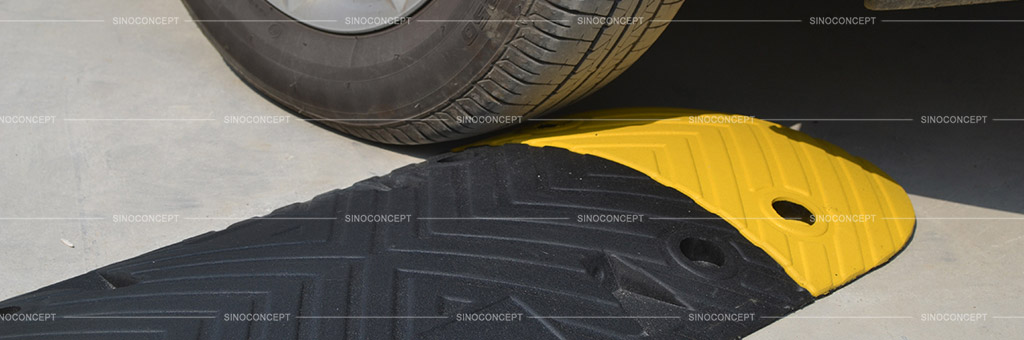 Rubber traffic speed bump also called sleeping policeman made of black and yellow rubber for traffic calming purpose