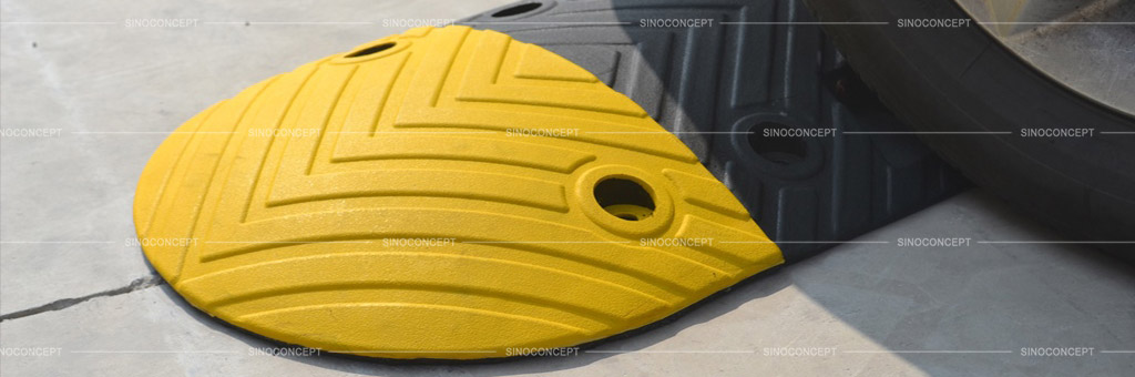 Speed bump made of vulcanized rubber with anti-slip arrows design and can be embedded with cat-eye reflectors