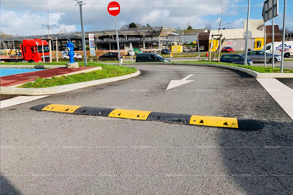 Safety speed bump also called speed ramp with black and yellow colours used in the parking spaces for car park management