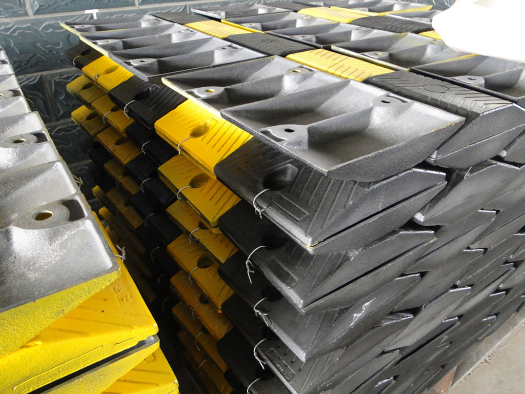 A lot of black and yellow steel speed bumps waiting to be sent to customers