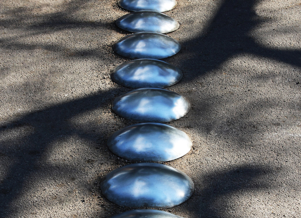 Small round speed bumps made of steel, installed on the road to calm traffic