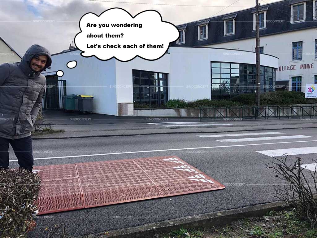 Red rubber speed cushion also called speed table placed on the road to calm traffic