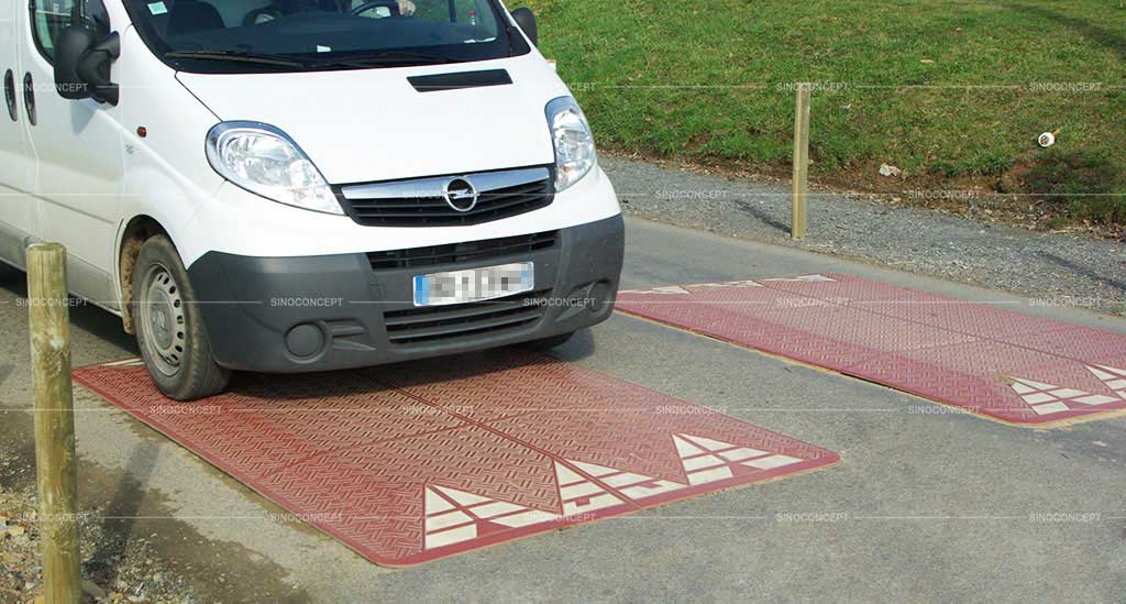 Two red speed cushions also called speed pillows made of rubber with white reflective films