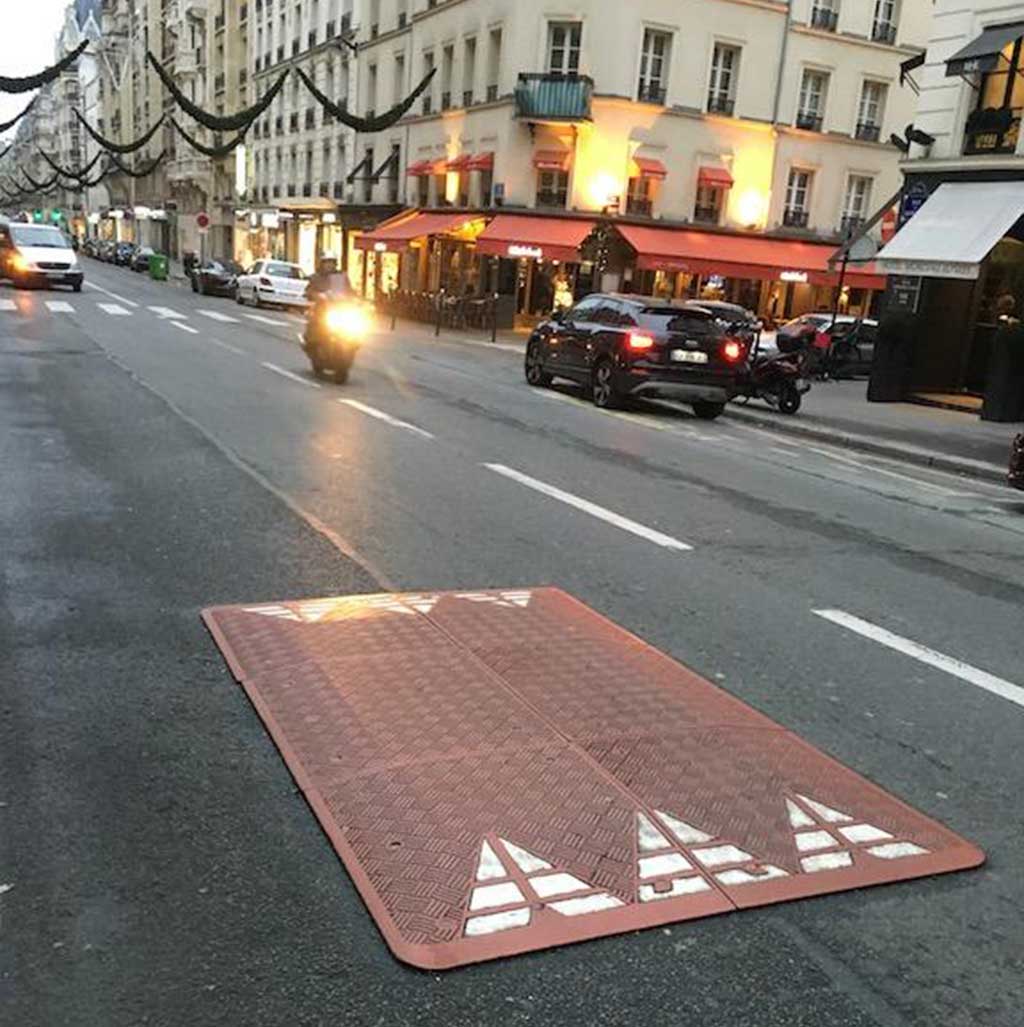 A red speed cushion used quite a long time on the road for traffic calming function