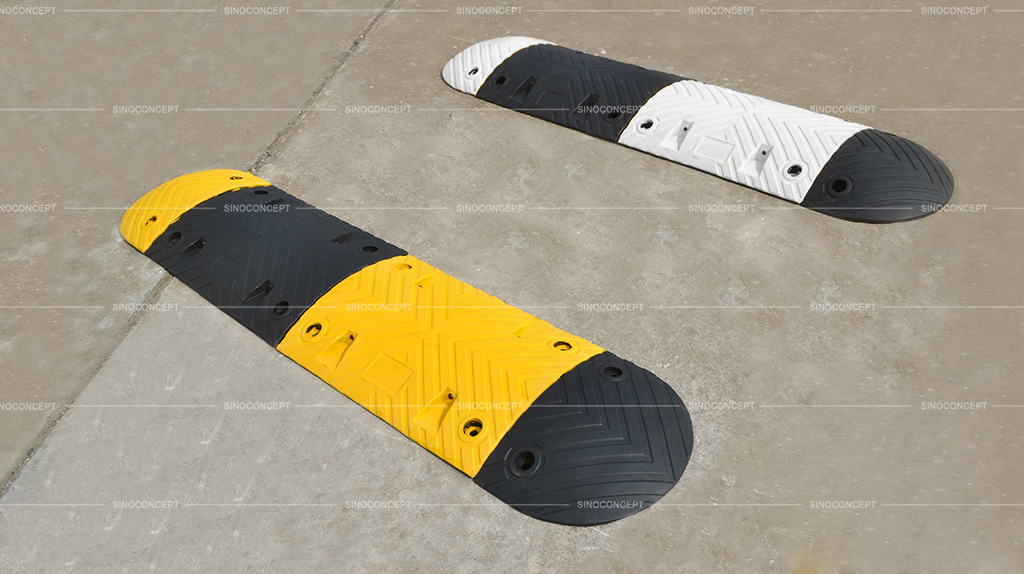 White and black, yellow and black speed bumps made of recycled rubber