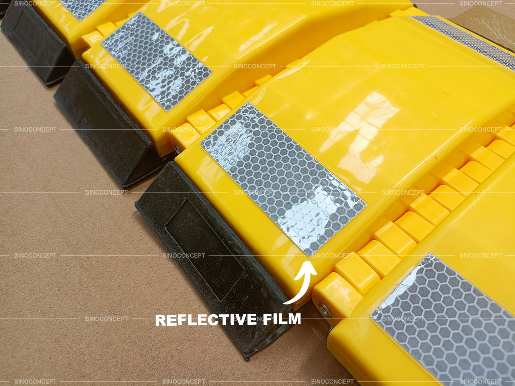 Reflective films are pasted on the yellow portable speed bumps for being more visible