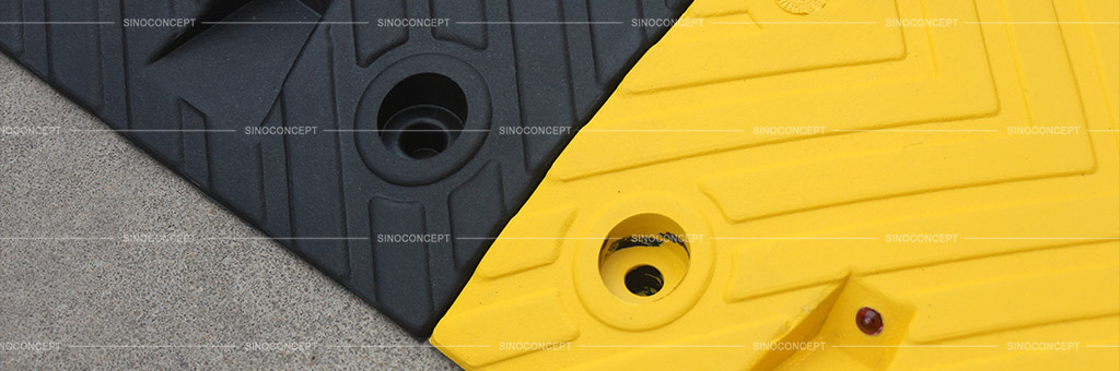 Rubber speed bump surface with a design to put reflective road studs for better function