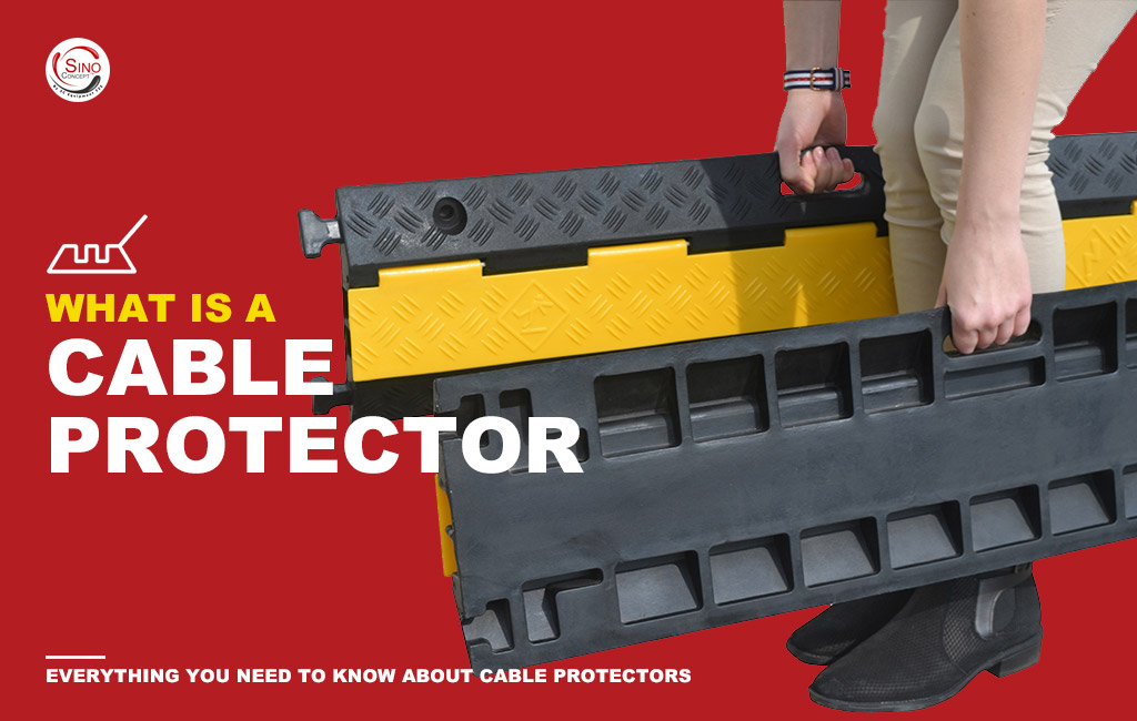 1-rubber-cable-protectors-3 A person carrying two rubber cable protectors.