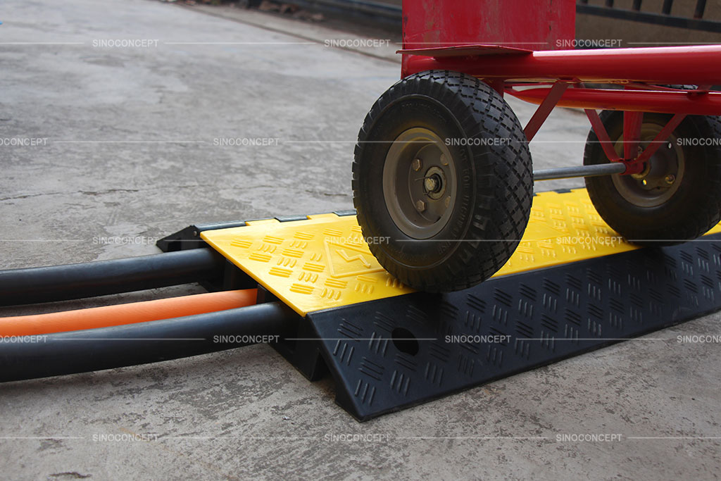 Rubber cable protector with yellow cover used to protect cables or hoses