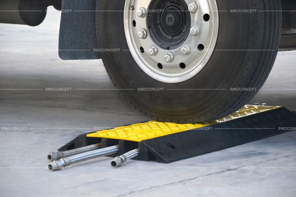 Three channels cable ramp made of rubber used to protect cables and hoses