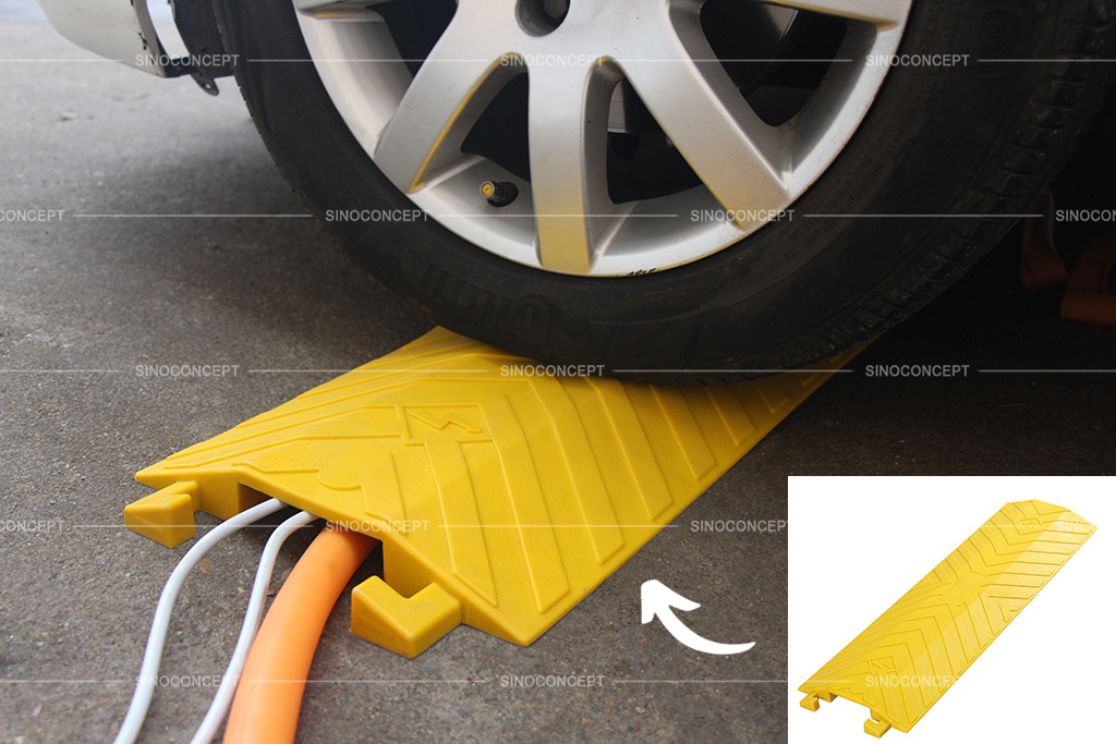 Yellow drop over cable protector used on the floor to cover cables or hoses