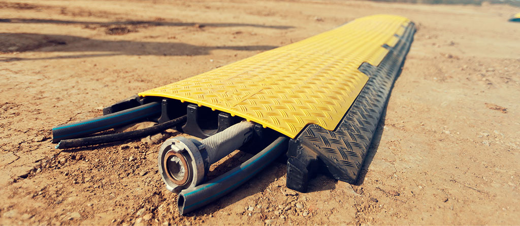 Five channels cable ramp with a yellow lid to protect cables or hoses