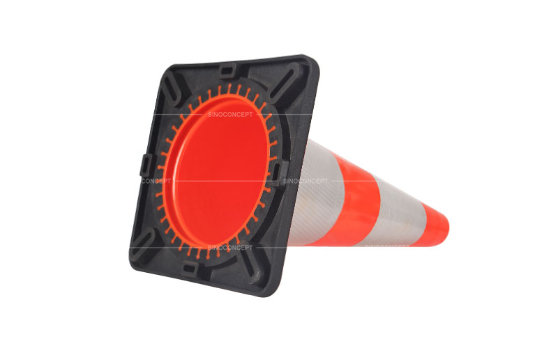 Bottom view of the black rubber base for orange PVC traffic cones also called road safety traffic cones