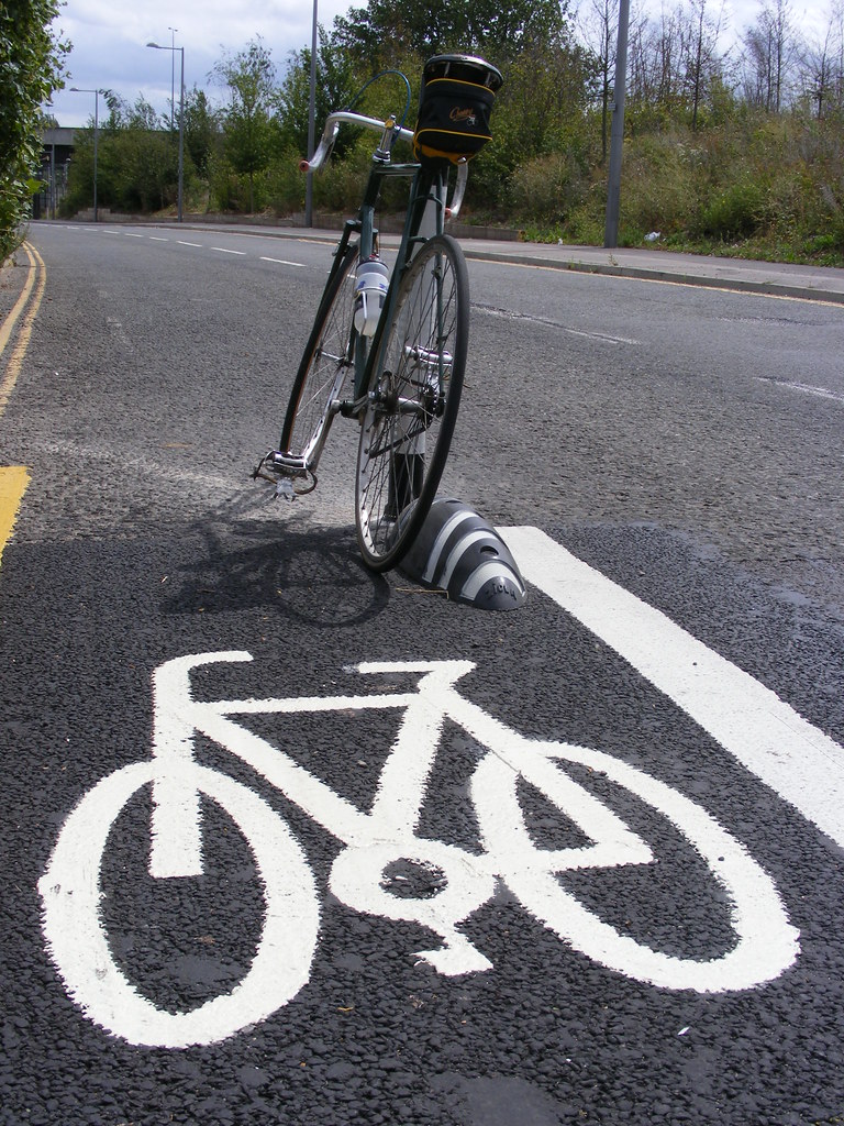 Armadillo lane separator cub and white road markings to indicate clear cycle lanes for cyclists