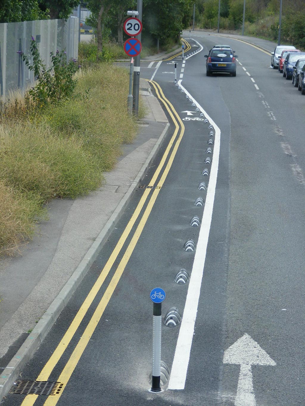 Armadillo cycle lane separators and signposts installed on the road to separate a cycle lane for traffic safety