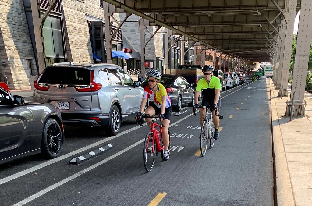 Black and white lane dividers to separate cycle lanes and motor lanes to reduce accidents